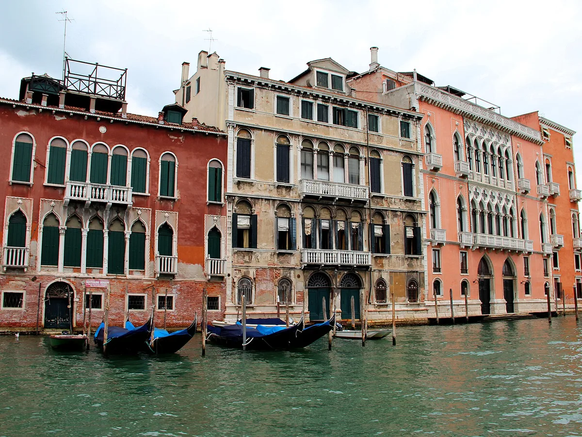A row of historic Venetian Gothic palaces along the Grand Canal